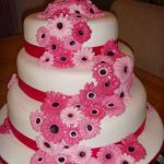 Torta rosa chiaro e fucsia, in pasta di zucchero