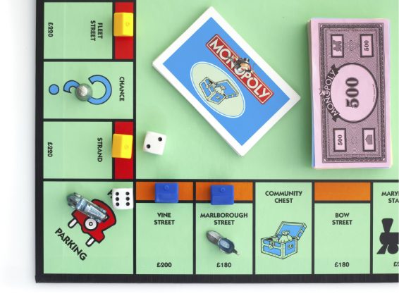 SWINDON, UK - JUNE 11, 2014: English Edition of Monopoly showing The Jail, The classic trading game from Parker Brothers was first introduced to America in 1935.
