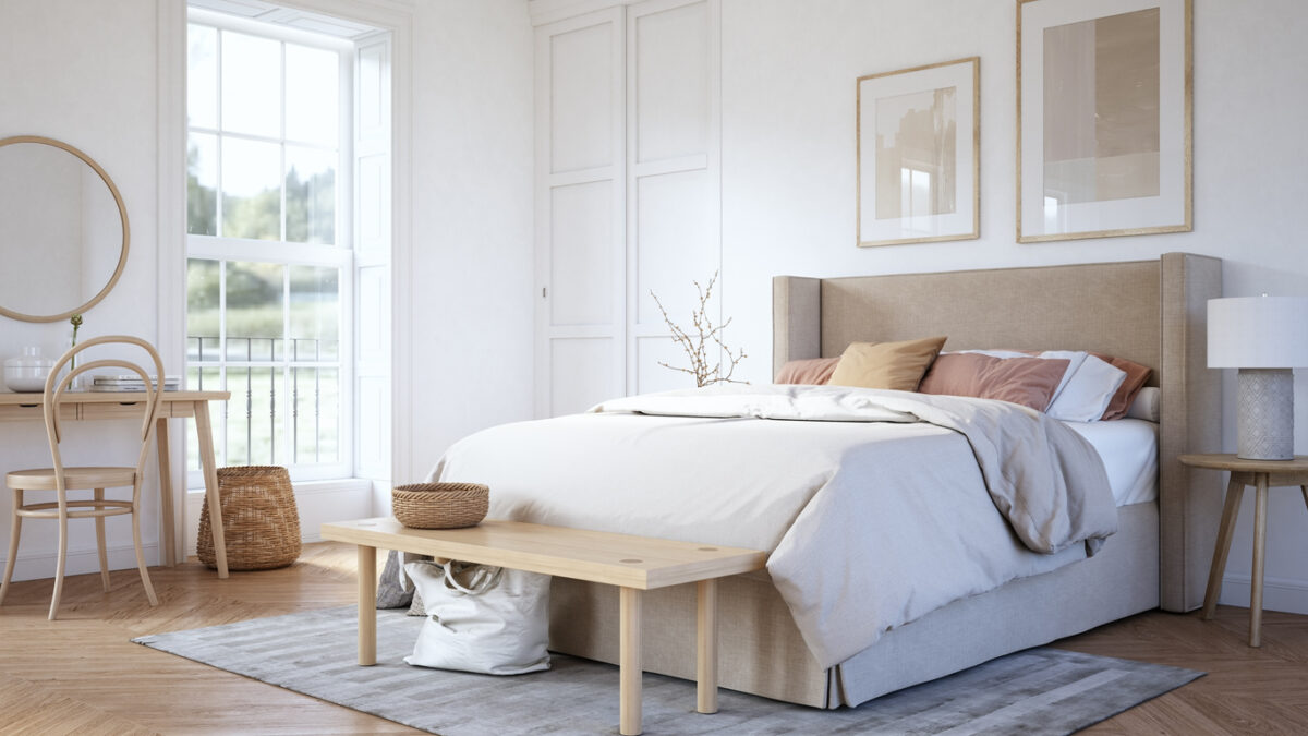 Camera da letto bianca arredata in stile moderno e minimal