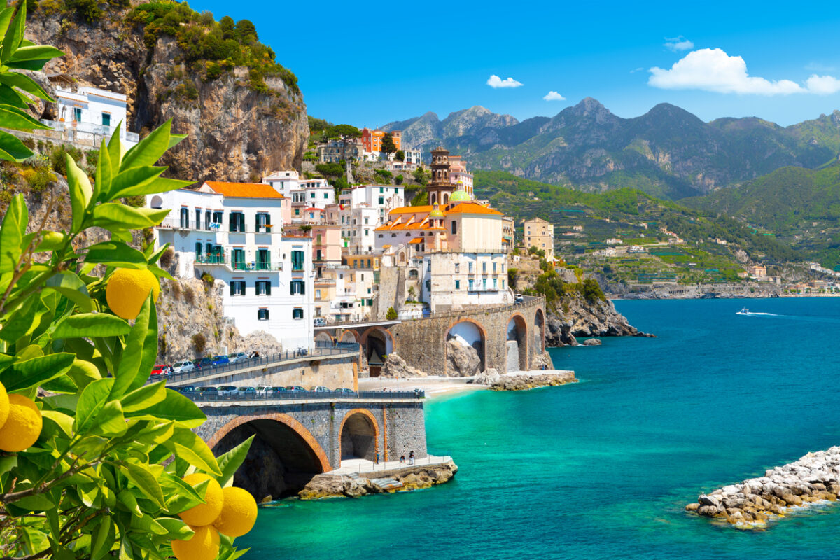 Beautiful view of Amalfi on the Mediterranean coast with lemons in the foreground, Italy Beautiful view of Amalfi on the Mediterranean coast with lemons in the foreground, Italy