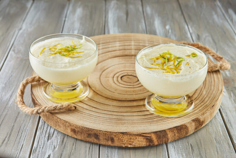 Lemon mousse, lovely French recipe dessert on wooden background.